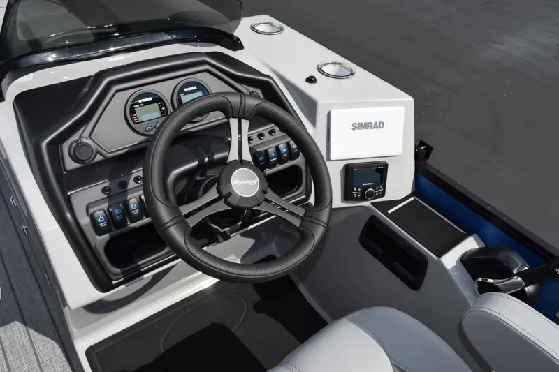 Slide: The Image of 2026 Bentley Pontoons Legacy 243 Swingback dashboard with steering wheel and Simrad display. - 12