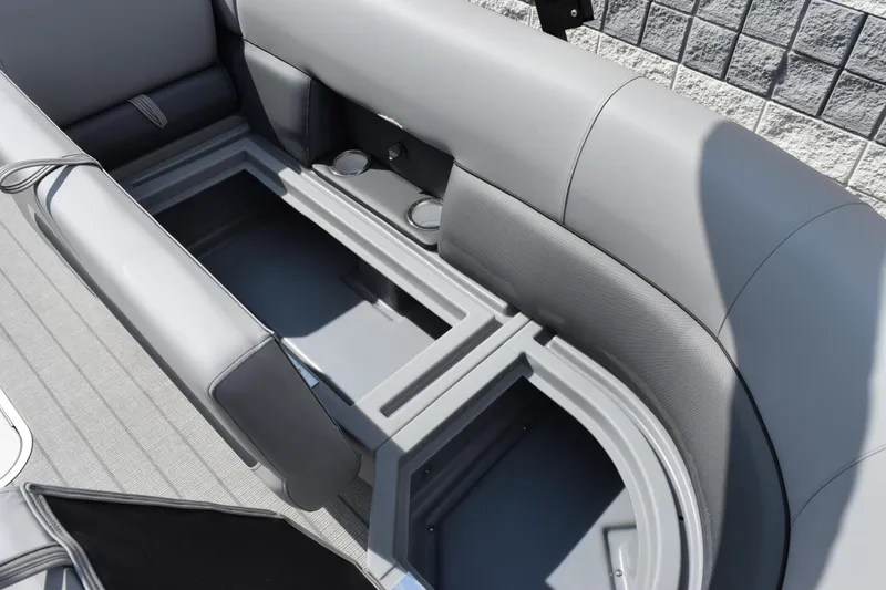 Slide: The Image of 2026 Bentley Pontoons Legacy 243 Swingback interior storage compartment with cup holders. - 15