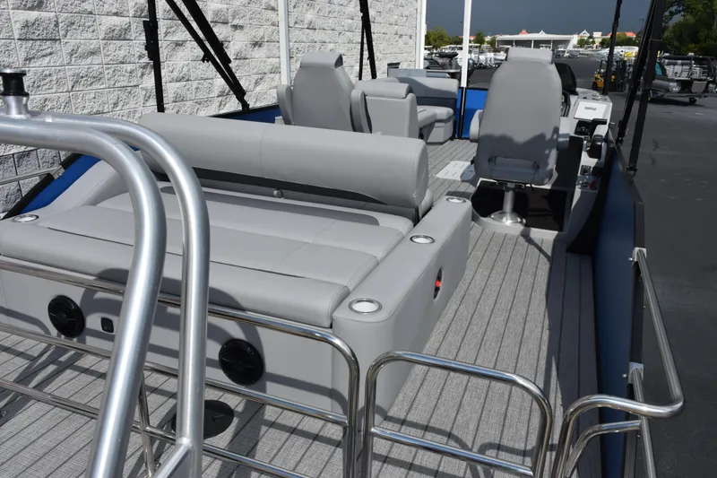 Slide: The Image of 2026 Bentley Pontoons Legacy 243 Swingback interior with gray seating and modern design. - 7