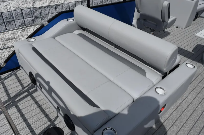 Slide: The Image of 2026 Bentley Pontoons Legacy 243 Swingback with luxurious gray seating and cup holders. - 8