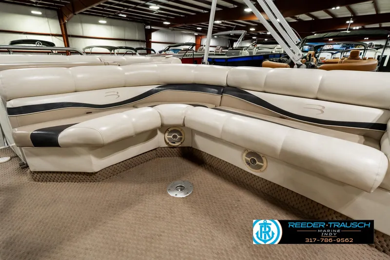 Slide: The Image of Interior of 2003 Bennington 2050 RL pontoon boat with seating and table. - 27
