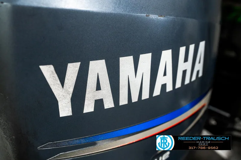 Slide: The Image of White leather cup holders on a 2003 Bennington 2050 RL boat interior. - 42