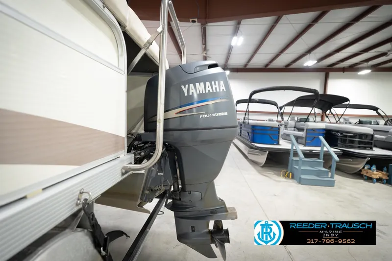 Slide: The Image of 2003 Bennington 2050 RL with Yamaha four-stroke engine in showroom. - 49
