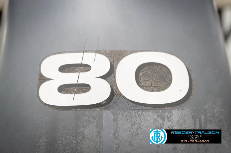 Slide: The Image of Close-up of number 80 on a Bennington 2050 RL, 2003 model. - 51