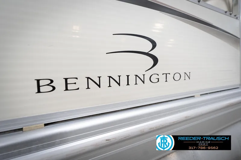 Slide: The Image of Close-up of 2003 Bennington 2050 RL boat logo with Reeder Trausch Marine contact. - 53