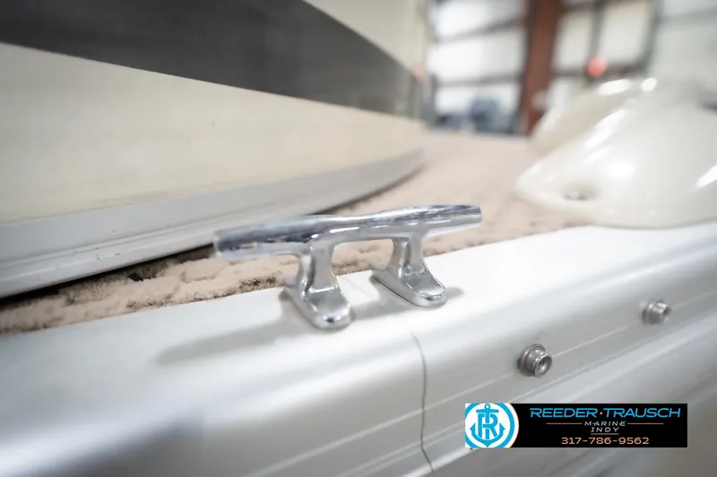 Slide: The Image of Close-up of a 2003 Bennington 2050 RL boat cleat in a showroom. - 56