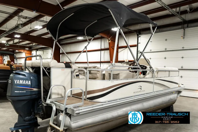 Slide: The Image of 2003 Bennington 2050 RL pontoon boat with Yamaha motor in indoor showroom. - 8