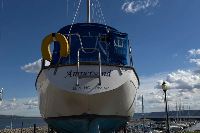Slide: The Image of 1982 Morgan 383 sailboat named "Ampersand" docked in Sleepy Hollow, NY under a blue sky. - 20