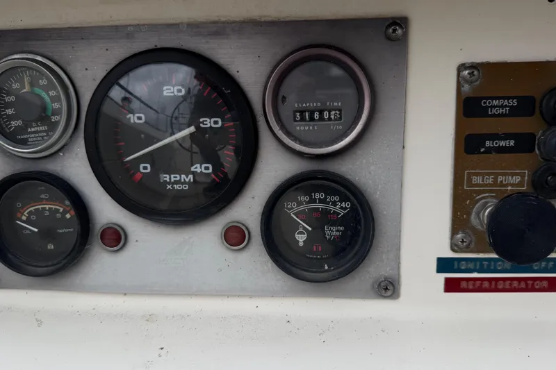 Slide: The Image of 1982 Morgan 383 dashboard with RPM, oil, and engine water temperature gauges. - 23