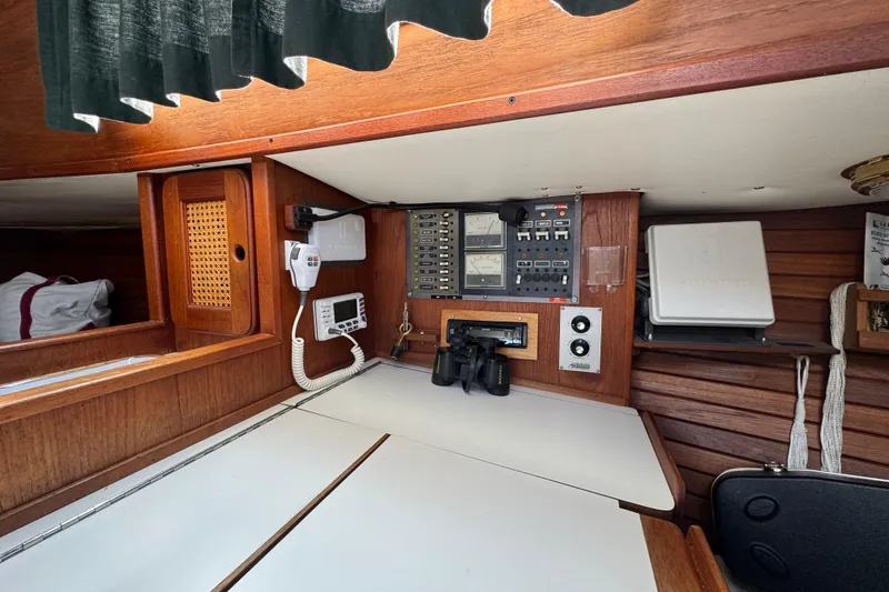 Slide: The Image of 1982 Morgan 383 yacht interior with navigation equipment and wooden cabinetry. - 28