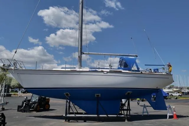 Slide: The Image of 1982 Morgan 383 sailboat on dry dock under clear blue sky. - 3