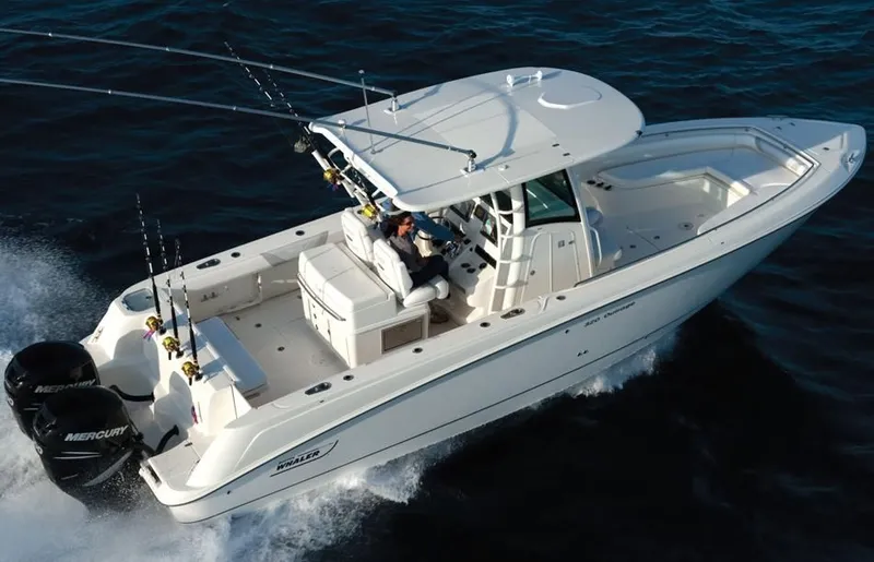 Slide: The Image of 2015 Boston Whaler 320 Outrage boat cruising on the water. - 30