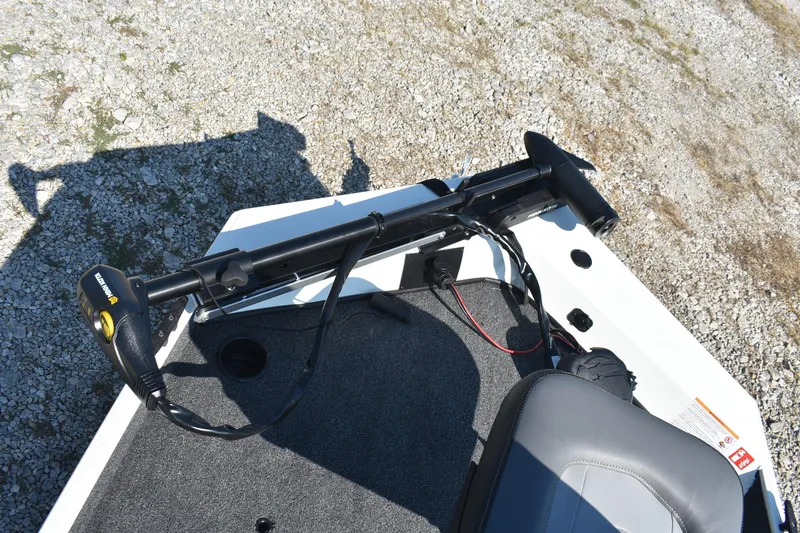 Slide: The Image of 2026 Lowe Skorpion 17 boat with trolling motor on gravel surface. - 14