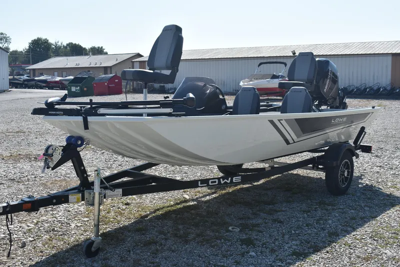 Slide: The Image of 2026 Lowe Skorpion 17 fishing boat on trailer in outdoor setting. - 4