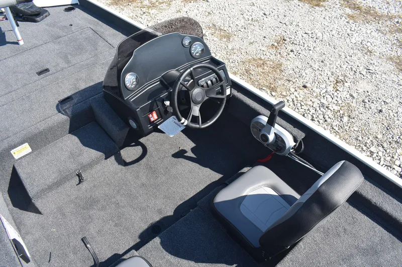 Slide: The Image of Interior of 2026 Lowe Skorpion 17 boat with steering wheel and control panel. - 9