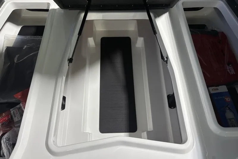 Slide: The Image of Open storage compartment of 2026 Skeeter ZXR19 SE boat, showcasing interior space. - 11
