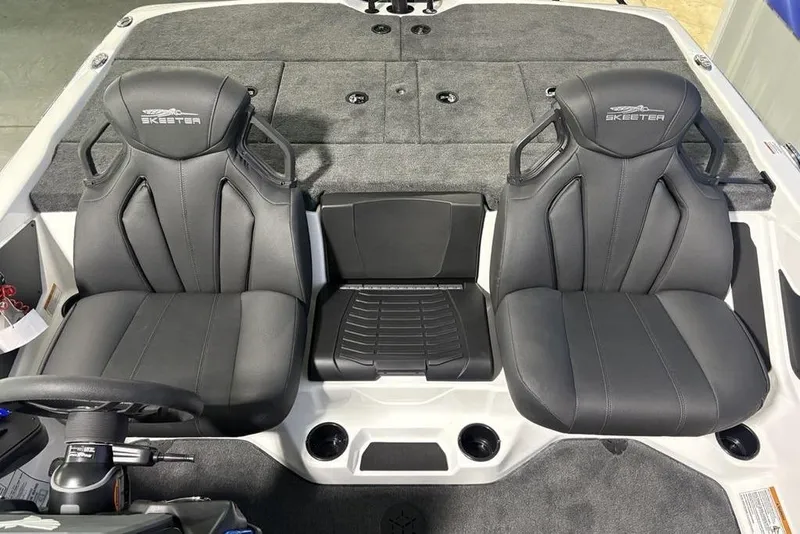 Slide: The Image of 2026 Skeeter ZXR19 SE boat interior with dual black seats and gray carpet. - 18