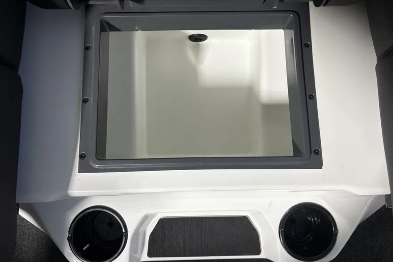 Slide: The Image of 2026 Skeeter ZXR19 SE boat storage compartment with cup holders, featuring a sleek design. - 19