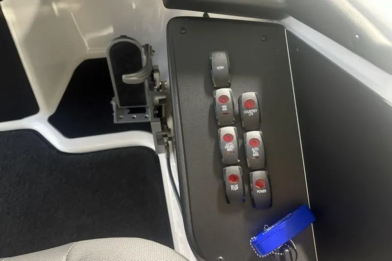 Slide: The Image of Control panel of 2026 Skeeter ZXR19 SE boat with labeled switches. - 22