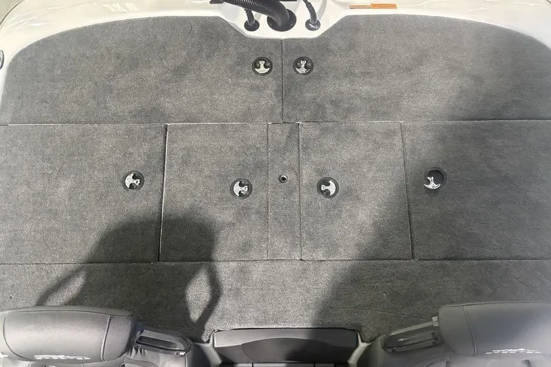 Slide: The Image of 2026 Skeeter ZXR19 SE boat deck with gray carpet and storage compartments. - 23