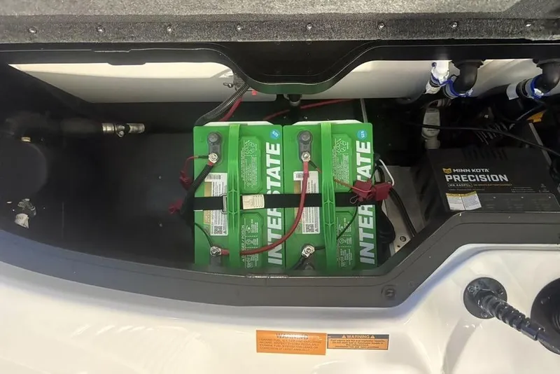 Slide: The Image of Battery compartment of 2026 Skeeter ZXR19 SE with Interstate batteries and Minn Kota Precision charger. - 25