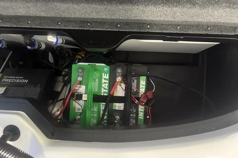 Slide: The Image of Battery compartment of 2026 Skeeter ZXR19 SE with Interstate batteries and Minn Kota Precision charger. - 27