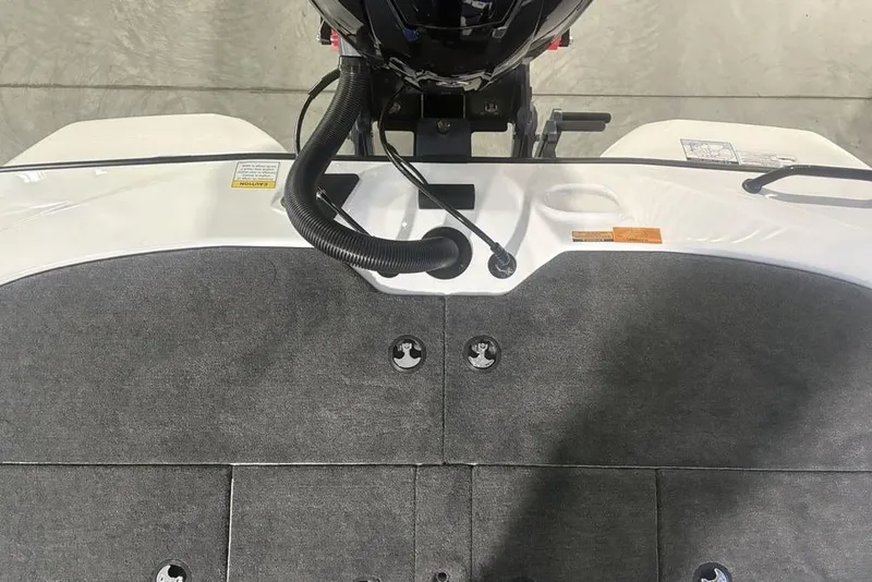 Slide: The Image of 2026 Skeeter ZXR19 SE boat deck with motor and carpeted surface. - 30