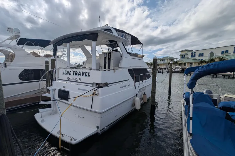 Slide: The Image of 1994 Carver 370 Aft Cabin Motor Yacht docked in Key Largo marina. - 1