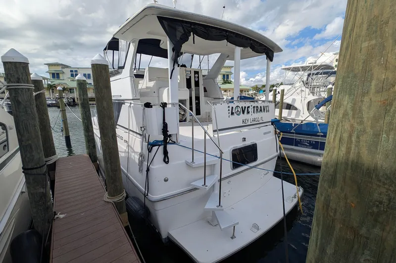 Slide: The Image of 1994 Carver 370 Aft Cabin Motor Yacht docked in marina, Key Largo, Florida. - 2