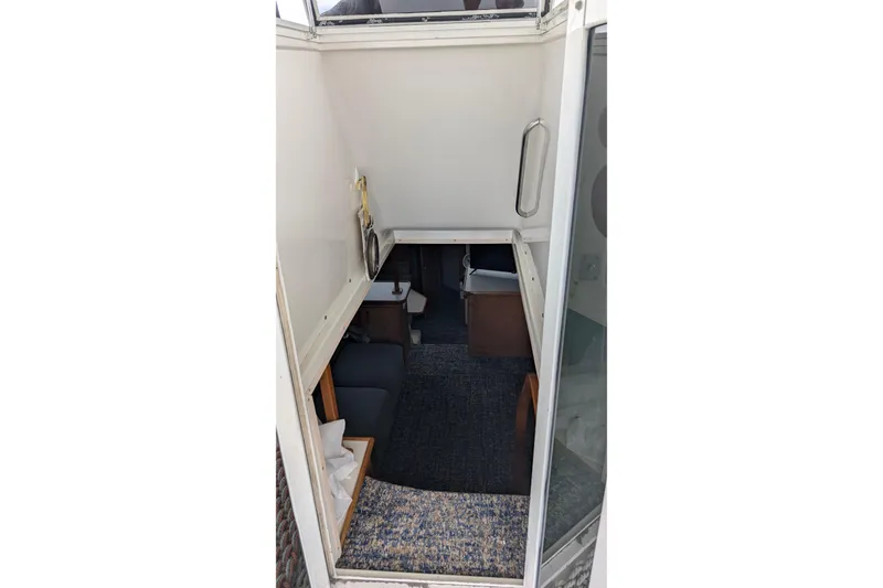 Slide: The Image of Interior view of 1994 Carver 370 Aft Cabin Motor Yacht, featuring cozy seating area. - 20