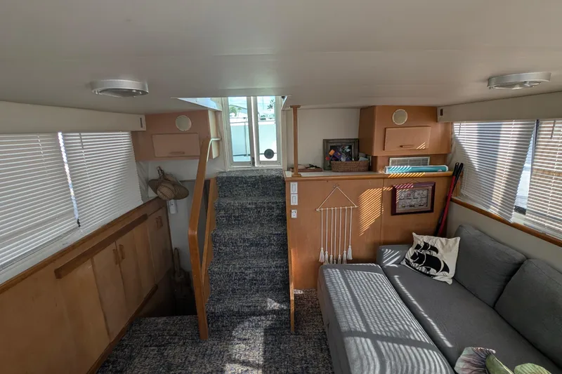 Slide: The Image of Interior of 1994 Carver 370 Aft Cabin Motor Yacht with cozy seating and natural light. - 40