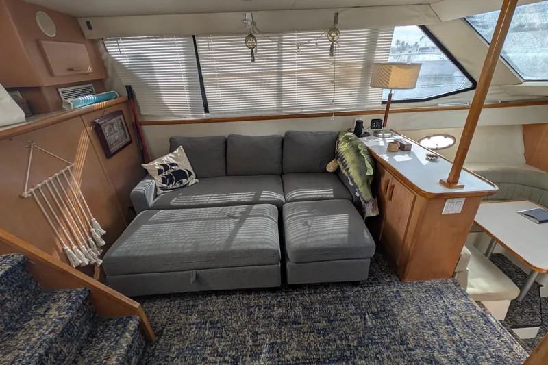 Slide: The Image of Interior of 1994 Carver 370 Aft Cabin Motor Yacht with cozy seating and nautical decor. - 24