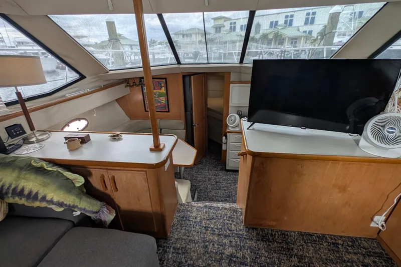 Slide: The Image of Interior of 1994 Carver 370 Aft Cabin Motor Yacht with TV and seating area. - 27