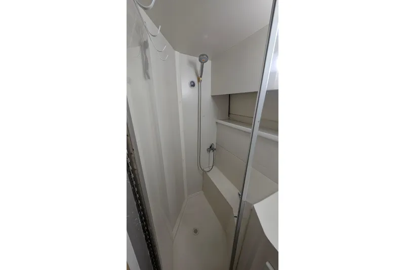 Slide: The Image of Shower area in 1994 Carver 370 Aft Cabin Motor Yacht, featuring a handheld showerhead. - 49