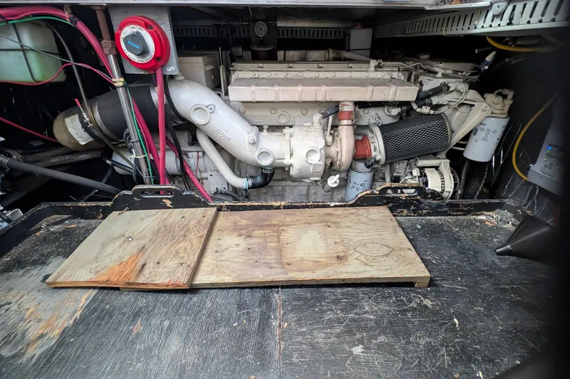 Slide: The Image of Engine compartment of a 1994 Carver 370 Aft Cabin Motor Yacht, showing mechanical components. - 51