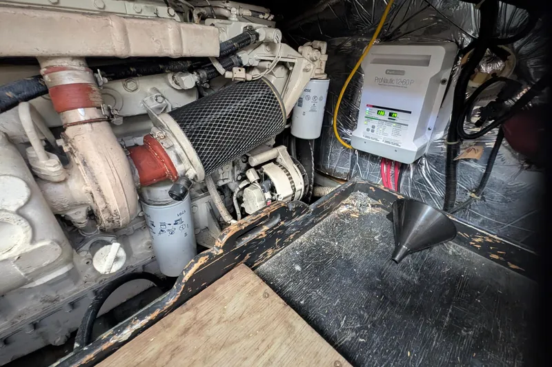 Slide: The Image of Engine room of 1994 Carver 370 Aft Cabin Motor Yacht with visible machinery and wiring. - 53