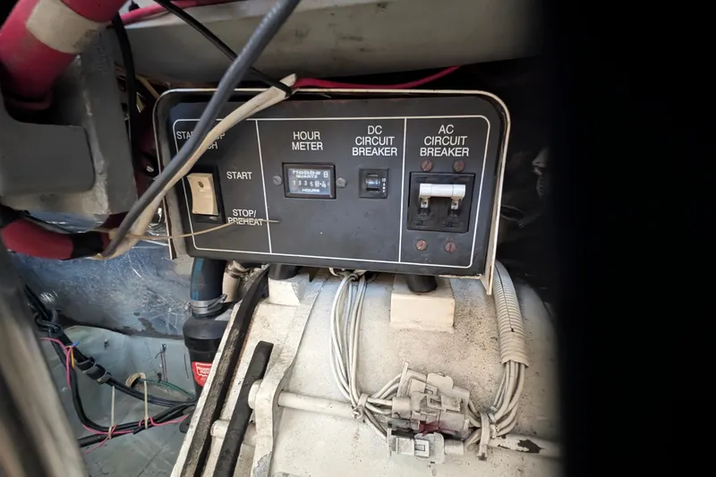 Slide: The Image of Control panel of a 1994 Carver 370 Aft Cabin Motor Yacht with hour meter and circuit breakers. - 56