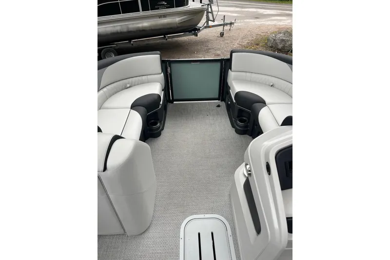 Slide: The Image of Interior of 2026 Tahoe 23 LTZ Quad Lounger pontoon boat with plush seating. - 10