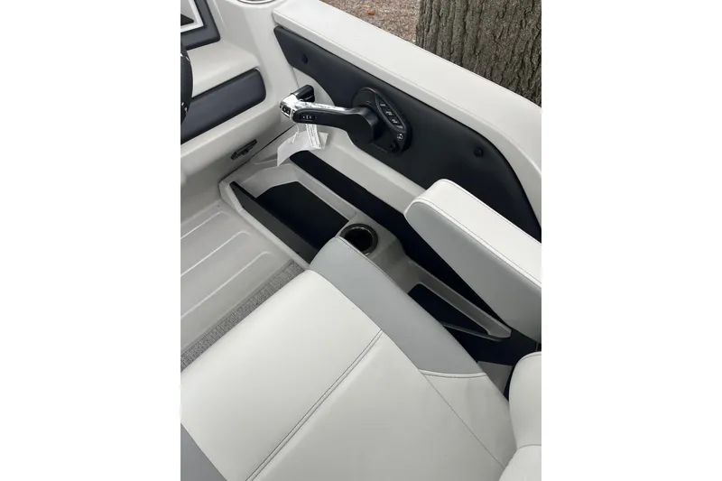 Slide: The Image of 2026 Tahoe 23 LTZ Quad Lounger interior with sleek white seating and modern controls. - 8