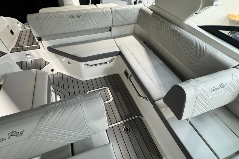 Slide: The Image of 2025 Sea Ray SDX 250 Outboard interior with seating and modern dashboard. - 12