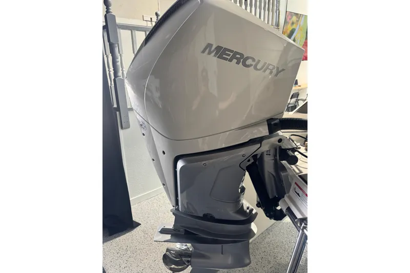 Slide: The Image of 2025 Sea Ray SDX 250 Outboard interior with luxurious seating and modern dashboard. - 16