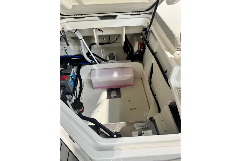 Slide: The Image of 2025 Sea Ray SDX 250 Outboard boat interior with compact bathroom and sink. - 18