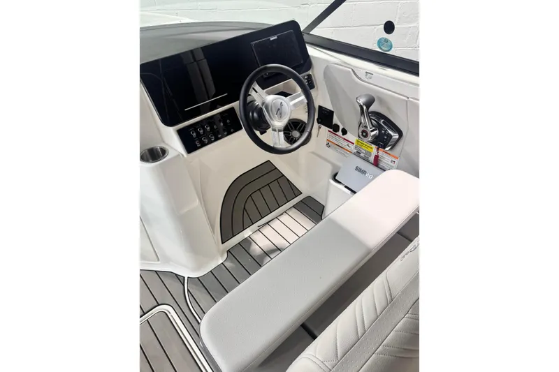 Slide: The Image of Manufacturer Provided Image: 2025 Sea Ray SDX 250 Outboard cruising on a serene lake at sunset. - 9