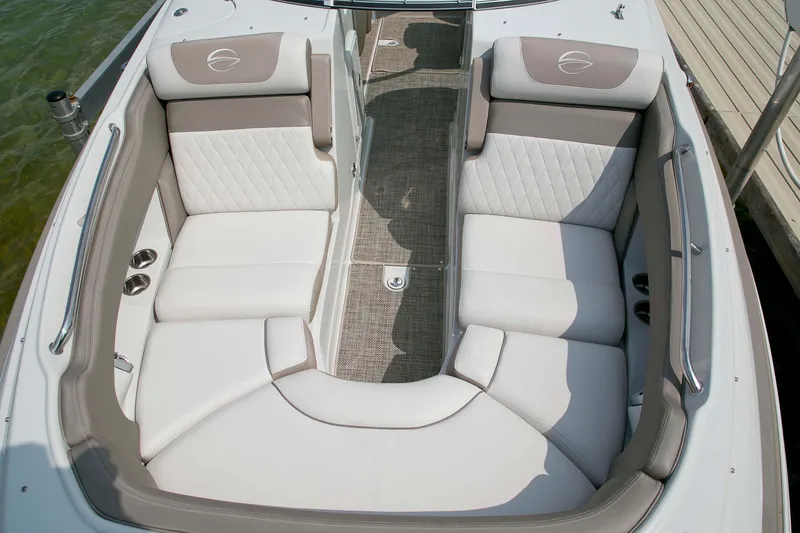 Slide: The Image of 2026 Crownline Eclipse E275 boat interior with luxurious white and gray seating. - 10