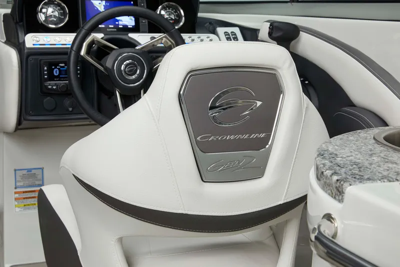 Slide: The Image of 2026 Crownline Eclipse E275 boat interior with steering wheel and dashboard. - 5