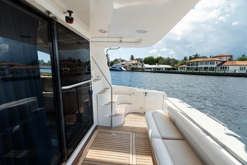 Slide: The Image of 2001 Sea Ray 540 Cockpit Motor Yacht with spacious deck and waterfront view. - 14