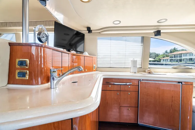 Slide: The Image of Luxurious interior of 2001 Sea Ray 540 Cockpit Motor Yacht with modern kitchen amenities. - 25