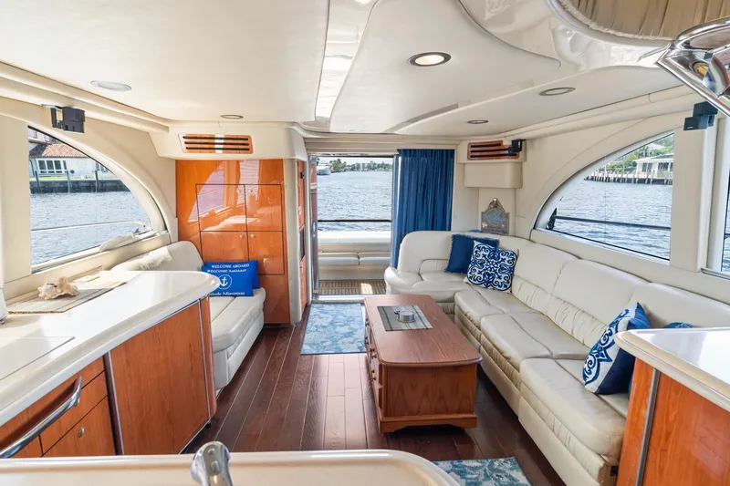 Slide: The Image of Luxurious interior of 2001 Sea Ray 540 Cockpit Motor Yacht with elegant seating and waterfront view. - 26