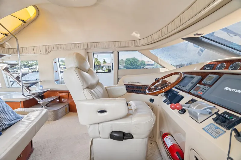 Slide: The Image of Interior of 2001 Sea Ray 540 Cockpit Motor Yacht with luxurious helm and seating. - 28