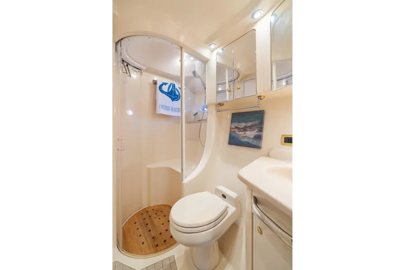 Slide: The Image of Luxurious bathroom in 2001 Sea Ray 540 Cockpit Motor Yacht with shower and modern fixtures. - 32